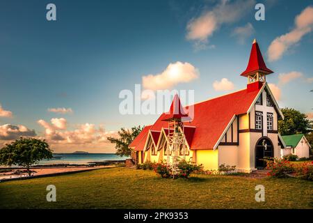 The famous Notre-Dame Auxiliatrice at Cap Malheureux church with its red roof in the evening at sunset Stock Photo