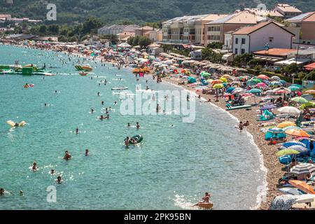 The full sandy beach in the main season in the place Baöka on the island of Krk in Croatia. Stock Photo