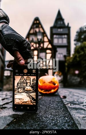 Pumpkin in front of a half-timbered house Halloween Stock Photo