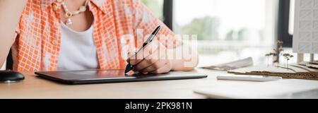 cropped view of architectural designer using graphic tablet while working in office, banner,stock image Stock Photo