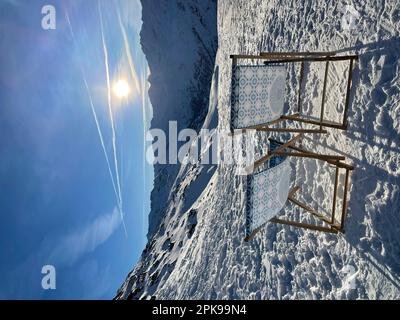 Two deck chairs in the ski resort Hochgurgl-Obergurgl in the back Ötztal, sun, back light, mountains, nature, activity, Ötztal, Sölden, Hochgurgl, Tyrol, Austria Stock Photo