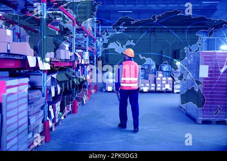 Worldwide logistics. Man with tablet working at warehouse and illustration of map Stock Photo