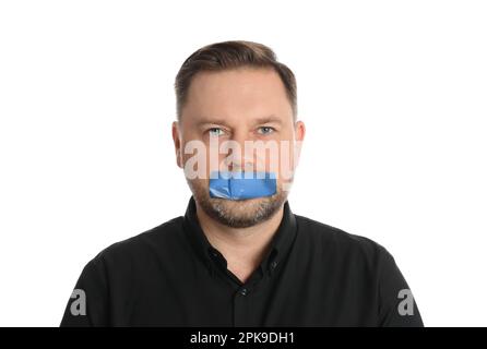 Mature man with taped mouth on white background. Speech censorship Stock Photo