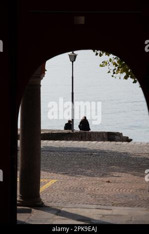 02.10.2016, Switzerland, Canton Ticino, Ascona - Mother and son looking at Lake Maggiore. 00A161002D210CAROEX.JPG [MODEL RELEASE: NO, PROPERTY RELEASE Stock Photo