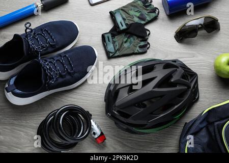 Flat lay composition with different cycling accessories on wooden background Stock Photo
