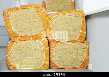 Packages of thermal insulation material in room Stock Photo