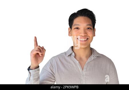 Handsome young healthy Asian man smiling with his finger pointing isolated on white banner background with copy space Stock Photo