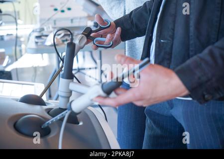 Internal students in digestive surgery train on a Lap Sim simulation device for surgical procedures. Stock Photo