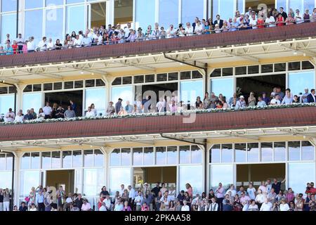 04.09.2022, Germany, Baden-Wuerttemberg, Iffezheim - Germany, visitors to the racecourse stand on the balconies of the Benazet Tribune. 00S220904D206C Stock Photo