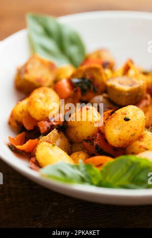 Gnocchi with Vegan Sausages and Bell Peppers Stock Photo