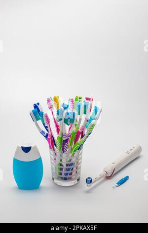 Mouthwash, many toothbrushes in toothbrush cup, electric toothbrush, by Braun Oral-B Type 3766, interdental brush, symbol image, teeth cleaning, white background, Stock Photo