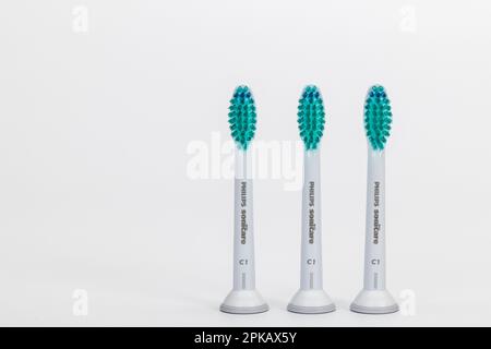 Three replacement brushes for electric toothbrush, from Philips Sonicare, sonic toothbrush, white background, Stock Photo