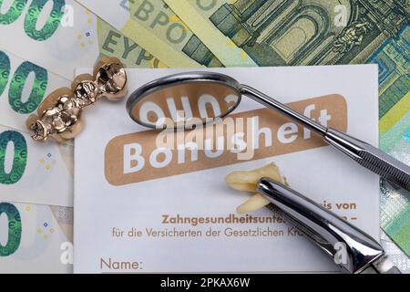 Bonus booklet, used partially veneered dental bridge, various bills, mouth mirror, tooth root, dental probe, detail, symbol image, denture, co-payment, Stock Photo