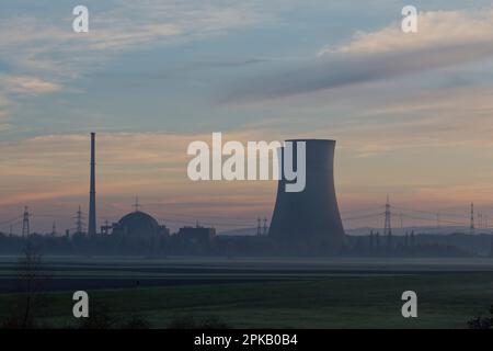 Grafenrheinfeld nuclear power plant in fog and evening light, Schweinfurt county, Lower Franconia, Franconia Bavaria, Germany Stock Photo