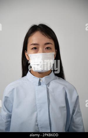 Young woman wearing protective mask. Stock Photo