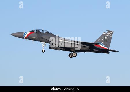 USAF F-15E assigned to the 48th Fighter Wing landing at RAF Lakenheath. Aircraft carries a special colour scheme for the 48th FW 70th anniversary. Stock Photo