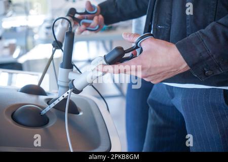 Internal students in digestive surgery train on a Lap Sim simulation device for surgical procedures. Stock Photo