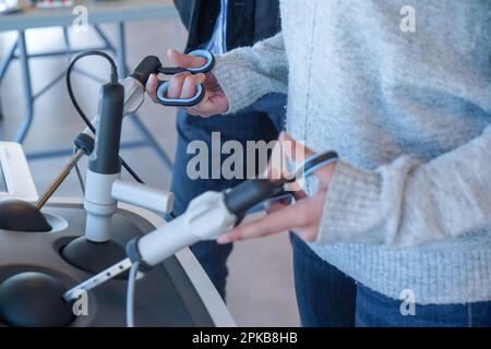 Internal students in digestive surgery train on a Lap Sim simulation device for surgical procedures. Stock Photo