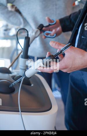 Internal students in digestive surgery train on a Lap Sim simulation device for surgical procedures. Stock Photo