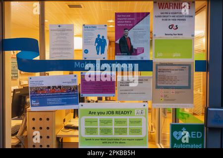 England, Dorset, Blandford Forum, Window of the Job Centre Plus, Colourful diplay of Posters Stock Photo