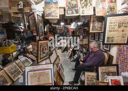 England, London, Spitalfields, Brick Lane, Vintage Market, Interior Antique Shop Selling Vintage Posters and Newspapers Stock Photo