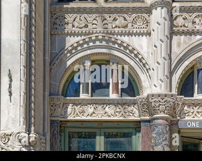 Williamsburgh Savings Bank’s limestone base is richly carved with savings and banking symbols. The former bank floor is now an event venue. Stock Photo