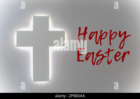 Happy Easter inscription on a wooden background with cookies in the form of Easter symbols of an egg, rabbit, butterfly and chicken Stock Photo