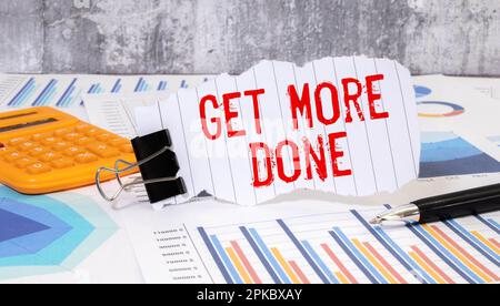 Get More Done Text written on notebook page, red pencil on the right. Motivational Concept image Stock Photo
