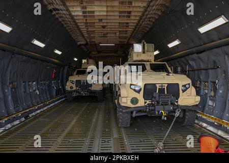 U.S. Marines with 1st Battalion, 10th Marine Regiment, 2d Marine Division prepare to disembark tactical vehicles during exercise Rolling Thunder on Fort Drum, New York, March 24, 2023. This exercise is a live-fire artillery event that tested the 10th Marine Regiment’s ability to operate in a simulated littoral environment against a peer threat in a dynamic and multi-domain scenario. (U.S. Marine Corps photo by Lance Cpl. Averi Rowton) Stock Photo