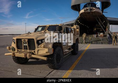 U.S. Marines with 1st Battalion, 10th Marine Regiment, 2d Marine Division disembark a joint light tactical vehicle during exercise Rolling Thunder on Fort Drum, New York, March 24, 2023. This exercise is a live-fire artillery event that tested the 10th Marine Regiment’s ability to operate in a simulated littoral environment against a peer threat in a dynamic and multi-domain scenario. (U.S. Marine Corps photo by Lance Cpl. Averi Rowton) Stock Photo