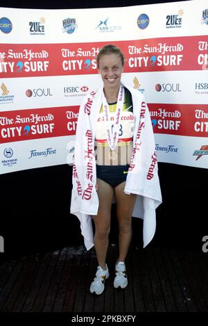 New Zealand’s Jessica Ruthe, winner of the women’s race, embraces her ...