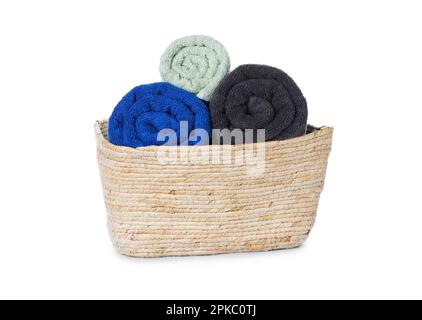 Fresh clean towels in wicker basket on white background Stock Photo