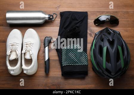 Flat lay composition with different cycling accessories on wooden background Stock Photo