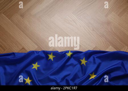 Flag of European Union on wooden table, top view. Space for text Stock Photo