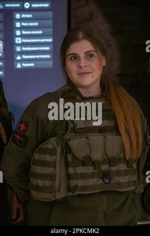 Lviv, Ukraine. 16th Feb, 2023. A military woman stands in uniform at a presentation and smiles. Military personnel demonstrate the operation of an interactive shooting range - a fire training simulator, which the City Hall of Lviv purchased for the National Guard of Ukraine, in order to better prepare the military for combat operations at the front. A Fire Training Stimulator is an augmented or virtual reality training device for military personnel to train to conserve ammunition and master more weapons. (Credit Image: © Olena Znak/SOPA Images via ZUMA Press Wire) EDITORIAL USAGE ONLY! Not Stock Photo