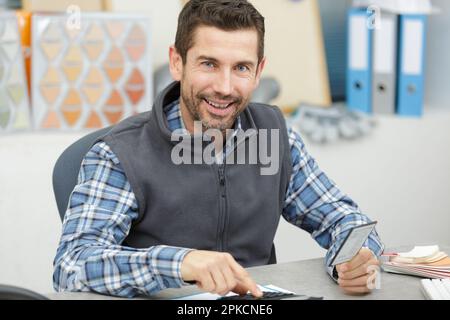 modern artisan looking at the camera in the office Stock Photo