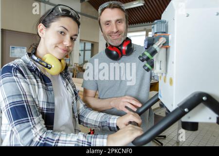 female engineer quality controlling components in factory Stock Photo