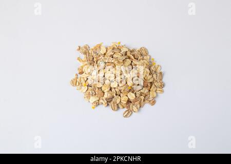 sprinkled oatmeal on a white background Stock Photo