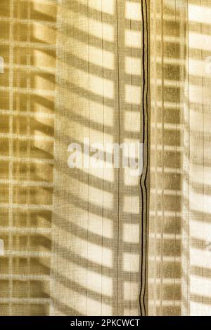 Bright sunlight through the curtain on the window. Stock Photo