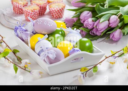 Easter table setting with painted eggs Stock Photo