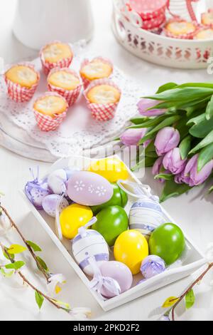 Easter table setting with painted eggs Stock Photo
