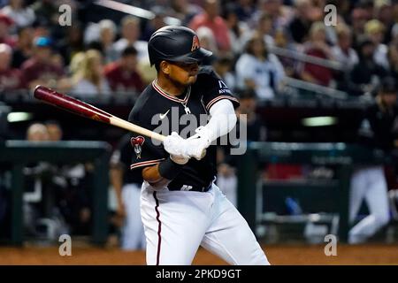 LOS ANGELES, CA - MARCH 30: Arizona Diamondbacks catcher Gabriel Moreno  (14) swings at a pitch during the MLB game between the Arizona Diamondbacks  and the Los Angeles Dodgers on March 30