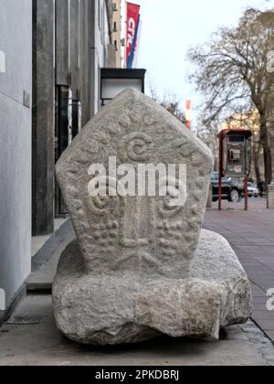 Belgrade, Serbia – February 2023: Medieval Stecak tombstone in front of the Ethnographic Museum Stock Photo