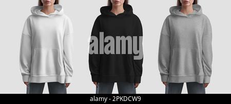 Mockup of fashionable long hoodie with pocket on girl, white, black, heather shirt, front, isolated on background. Close-up set of women's clothing. S Stock Photo
