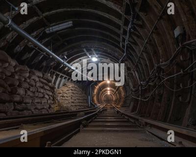 General view inside a tunnel of Mail Rail, the former  Post Office Railway system under the streets of central London, England. Stock Photo