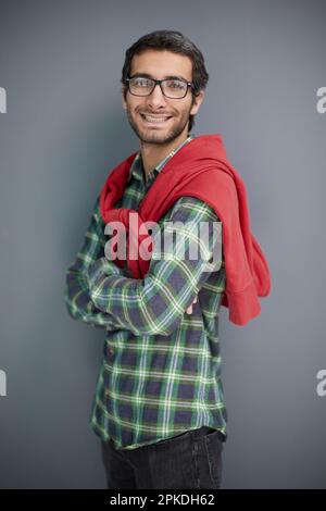 young unshaven business man posing against gray wall background studio portrait. Achieving career wealth business concept. Stock Photo