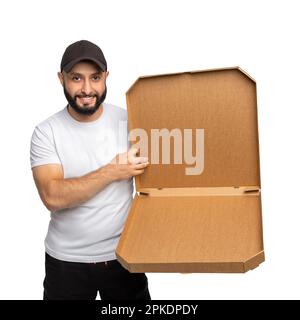 Young bearded man smiling while posing with open pizza box isolated over white background. Can be used to represent your product. Stock Photo