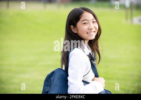 Female student in school uniform smiling Stock Photo