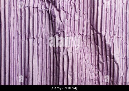 A purple corrugated paper texture in a close up view Stock Photo