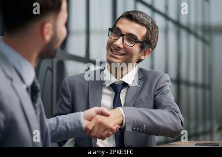 Two diverse business men analysts partners talking, working together Stock Photo